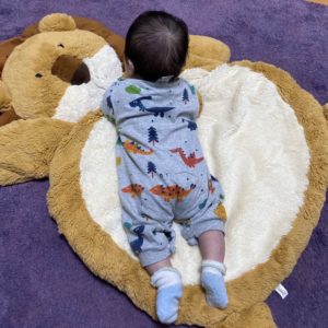 newborn on mat
