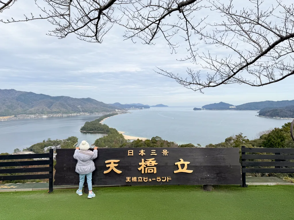 Girl looking at the view of Amanohashidate in Japan