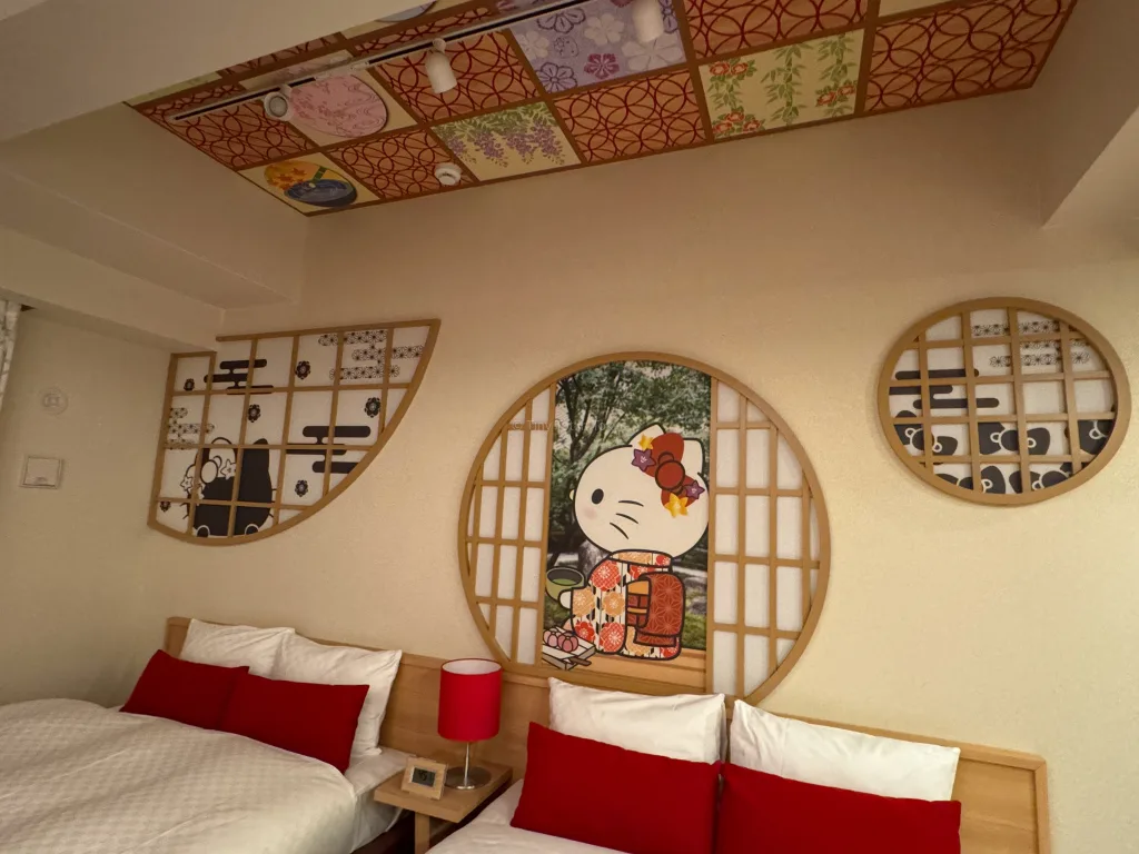 Beds at the Hello Kitty Room at RESI STAY THE KYOTO