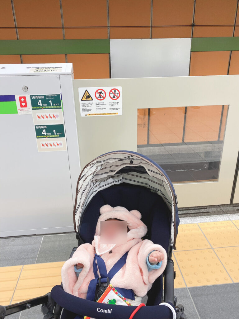 baby in a stroller at a station in Japan