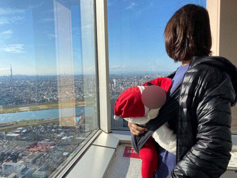 Baby looking at Tokyo skyline in Japan
