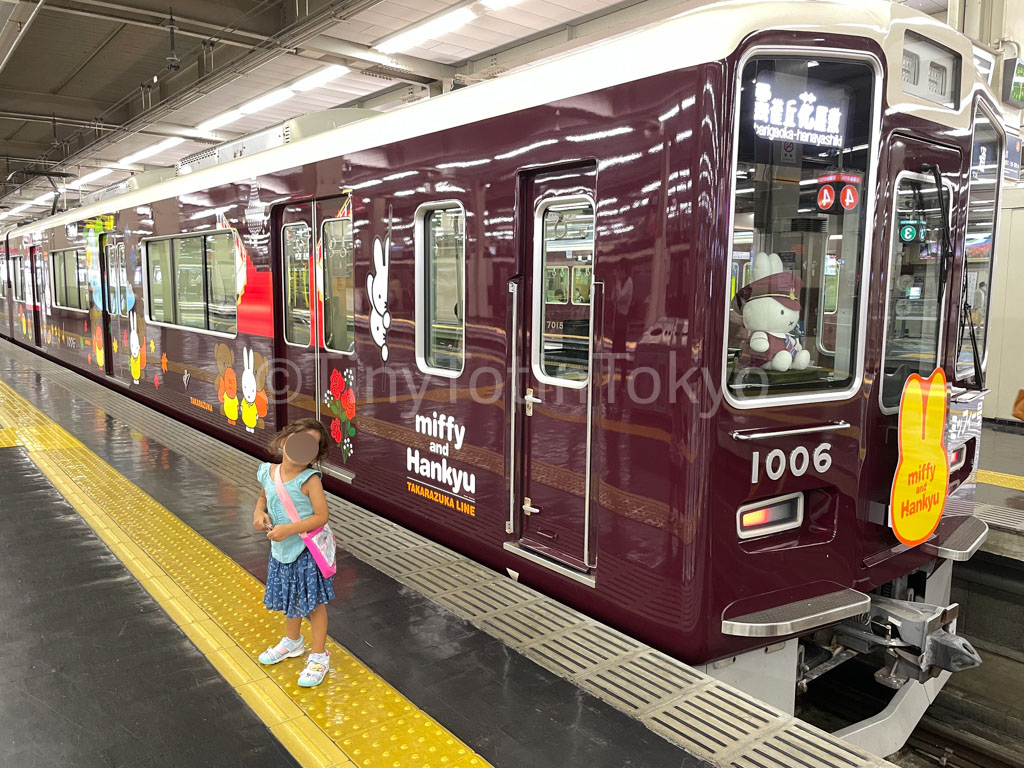 toddler in front of Miffy Hankyu train in Osaka