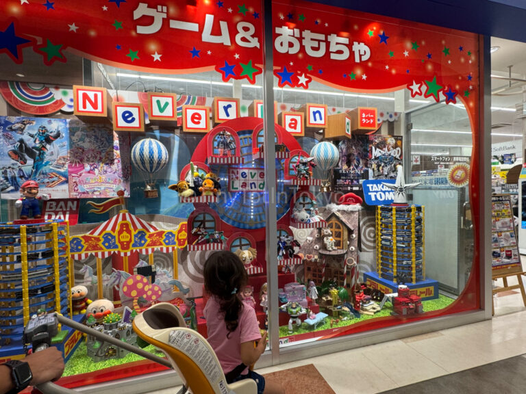 a girl in Japan looking at a toy store