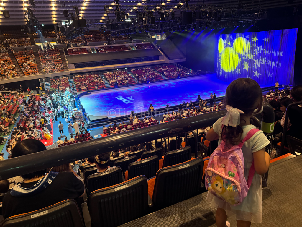 Girl looking out at stage for Disney on Ice in Japan 