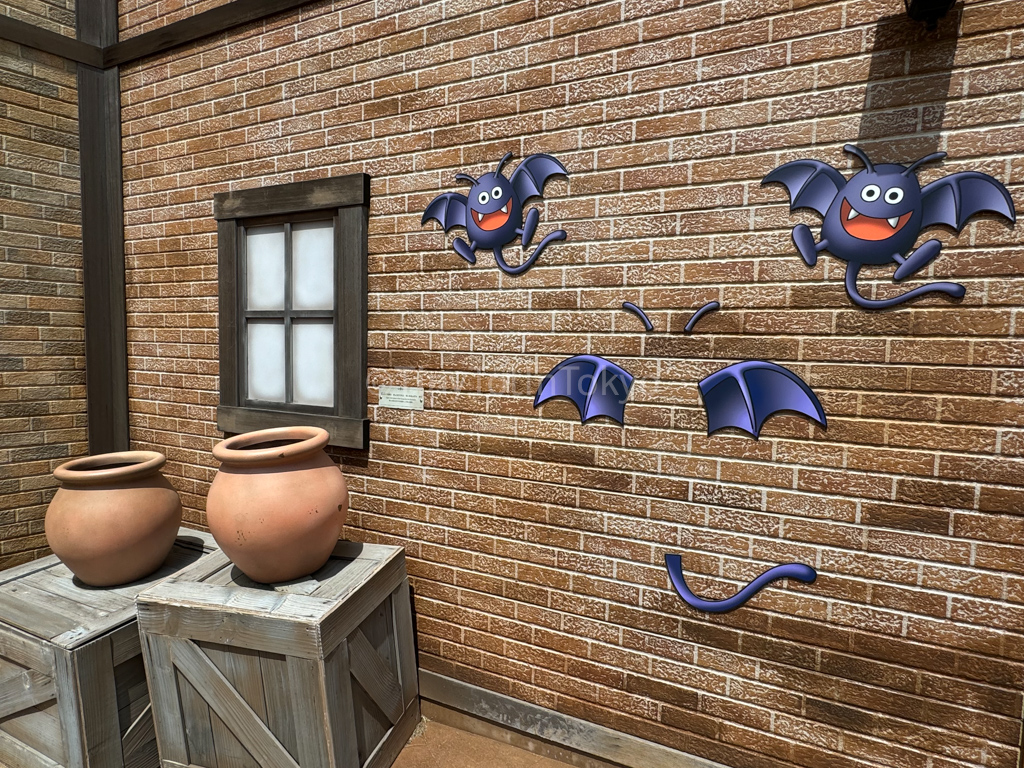 Dracky on a wall at Dragon Quest Theme Park in Japan