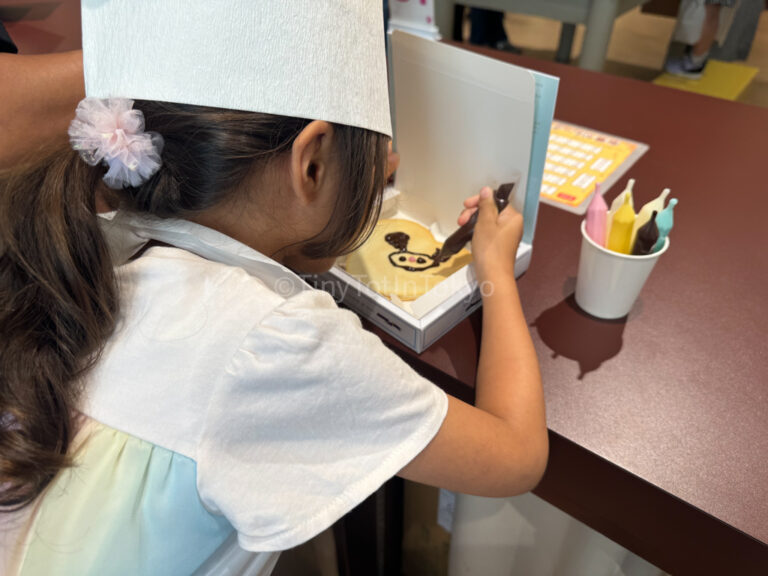 A child Decorating Shiroi Koibito Cookies in Sapporo Hokkaido