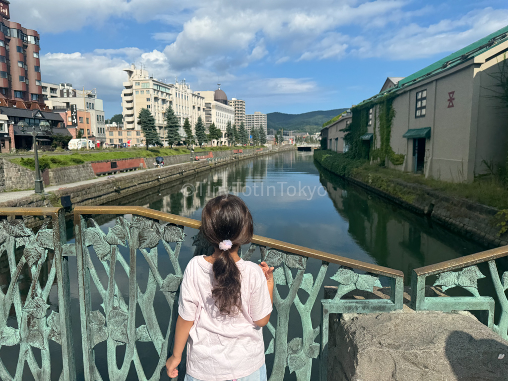 kid looking out at Otaru Canal in Hokkaido