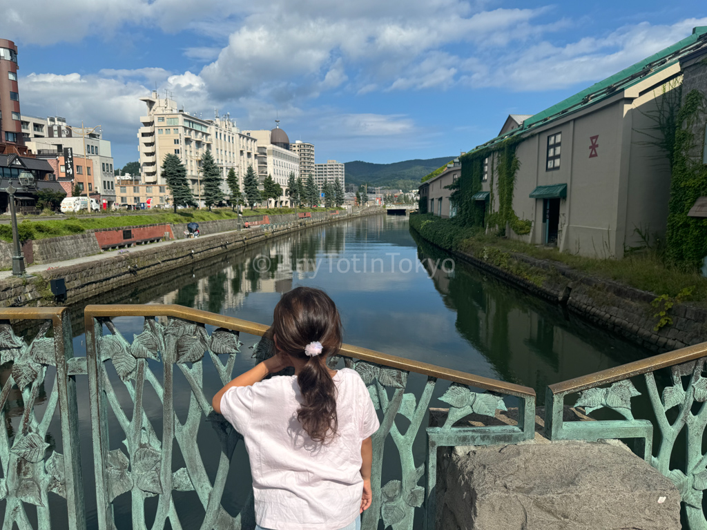 kid looking out at Otaru Canal in Hokkaido