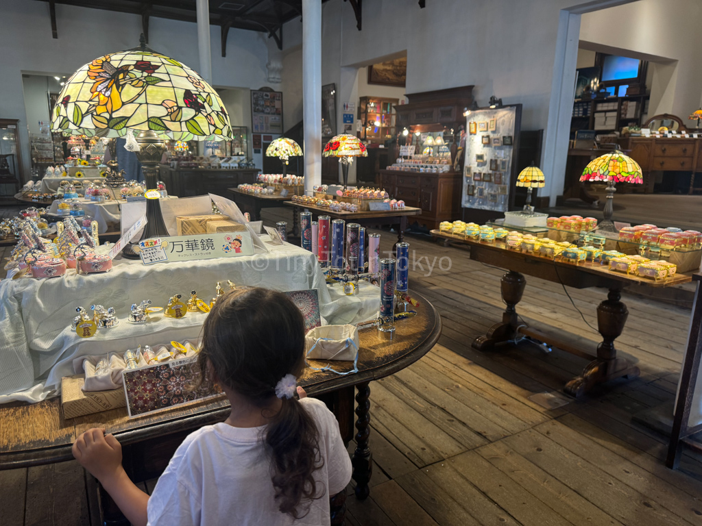 kid looking at music boxes in Otaru Hokkaido