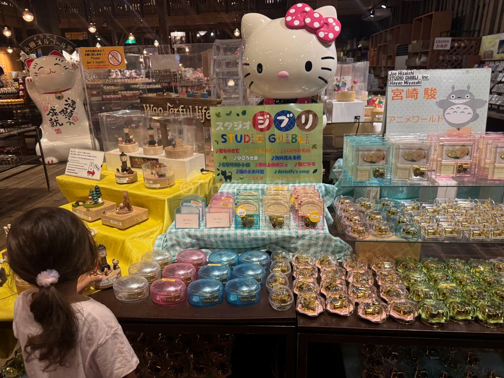 Kid looking at Hello Kitty music boxes in Otaru Hokkaido