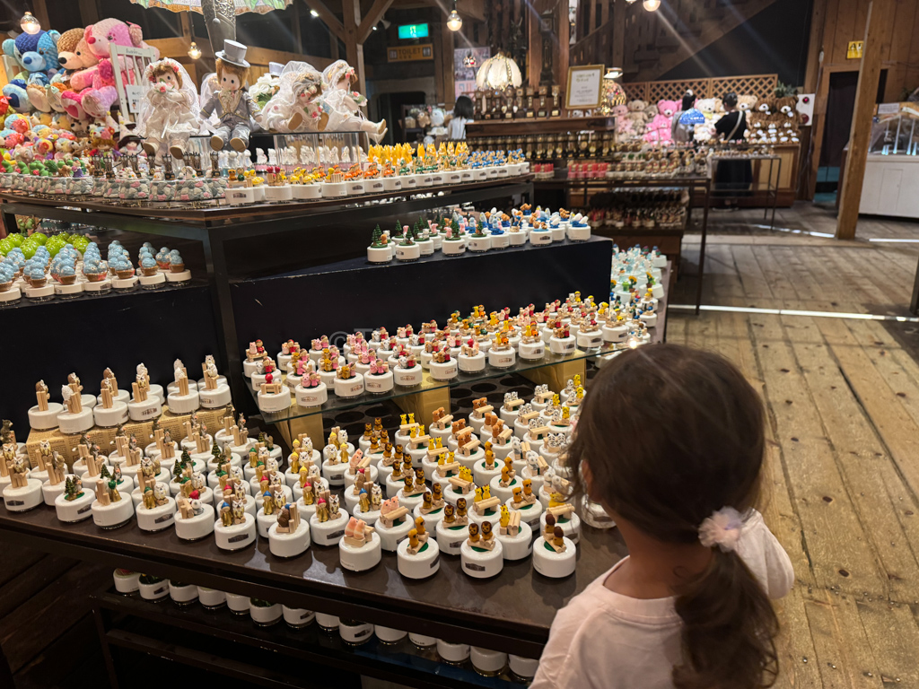 Kid looking at music boxes in Otaru