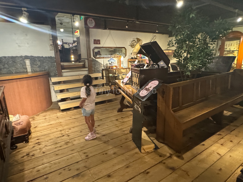 kid looking around Otaru music box museum in Hokkaido