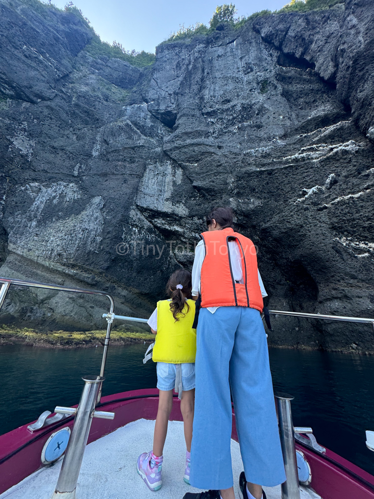 photo of author and daughter at stern of boat in Otaru