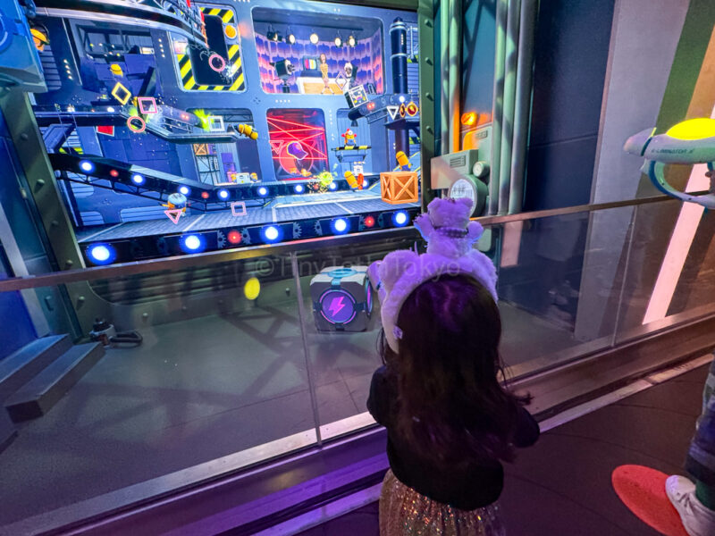 a child on the Illumination's Villain-Con Minion Blast ride at USJ