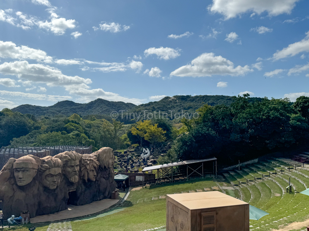 Naruto theme park grounds with Hokage rock