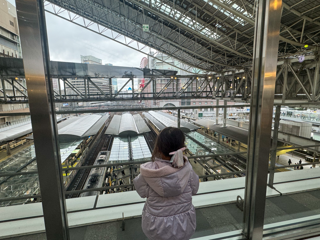 Child watching trains at toki no hiroba in Umeda