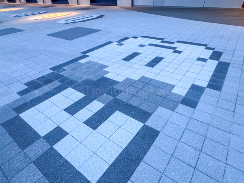 super mario characters on floor outside nintendo museum