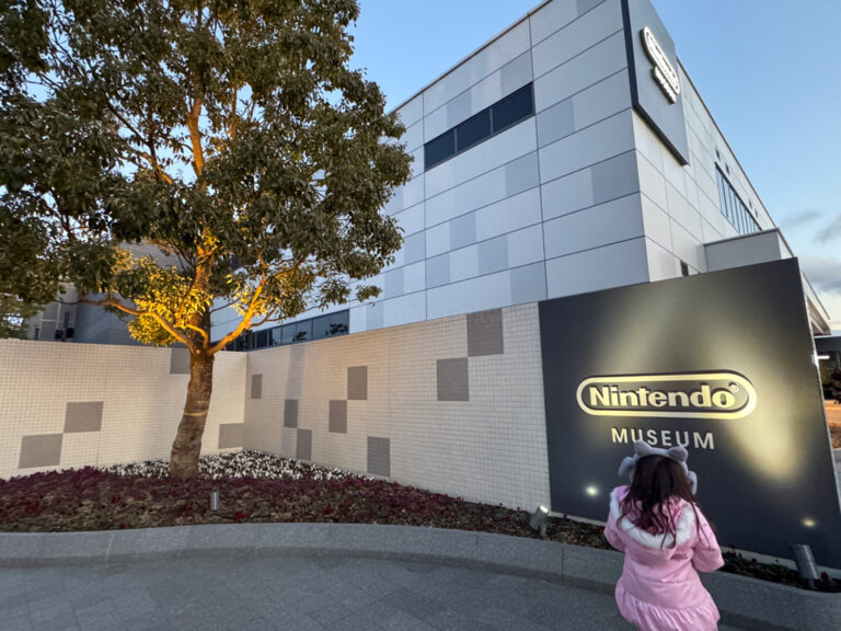 Child standing in front of the Nintendo Museum