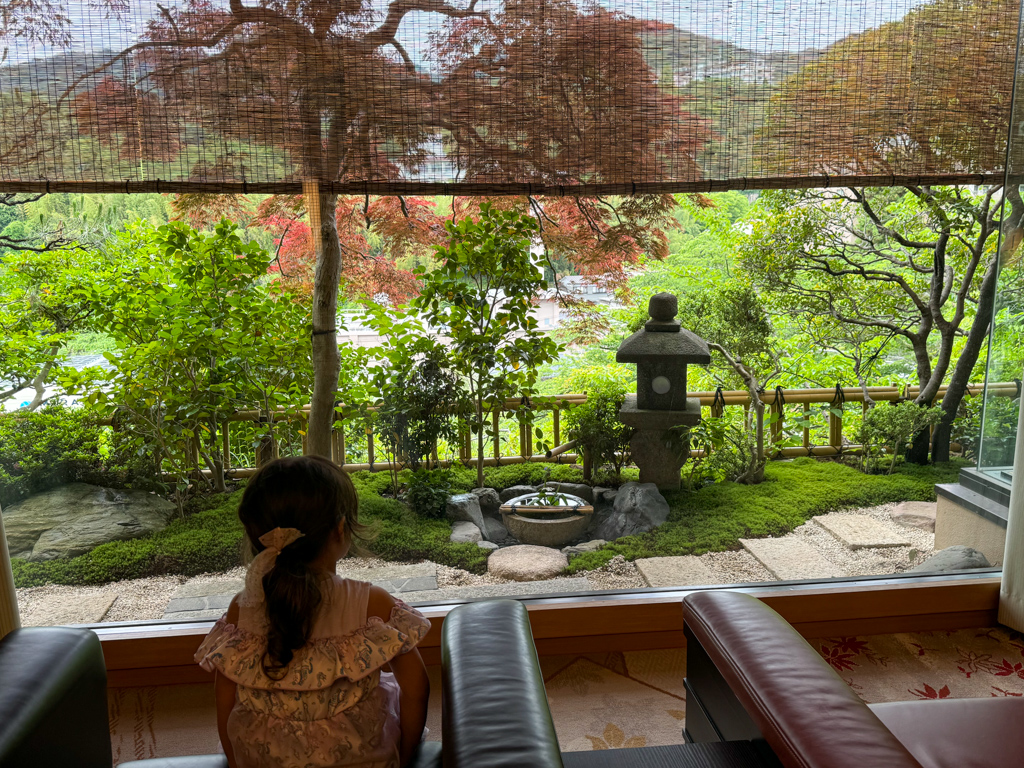 child sitting at a ryokan in Japan