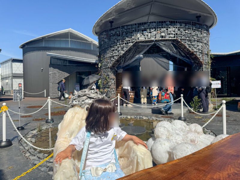 child sitting in ghost chair at future life zone osaka expo