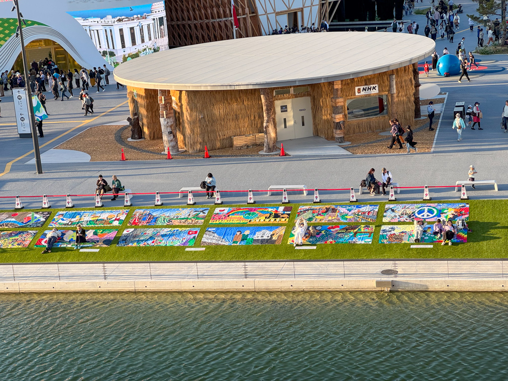 view from the grand ring of the sitting area near the fountain at osaka expo
