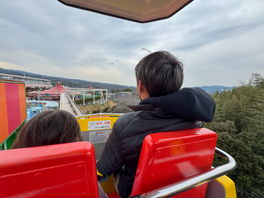 a parent and child on the sky jet ride at harmonyland