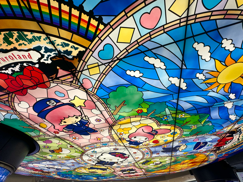 Stained glass ceiling at Keio-Tama Center Station with Sanrio characters such as Kiki, Hello Kitty and My Melody
