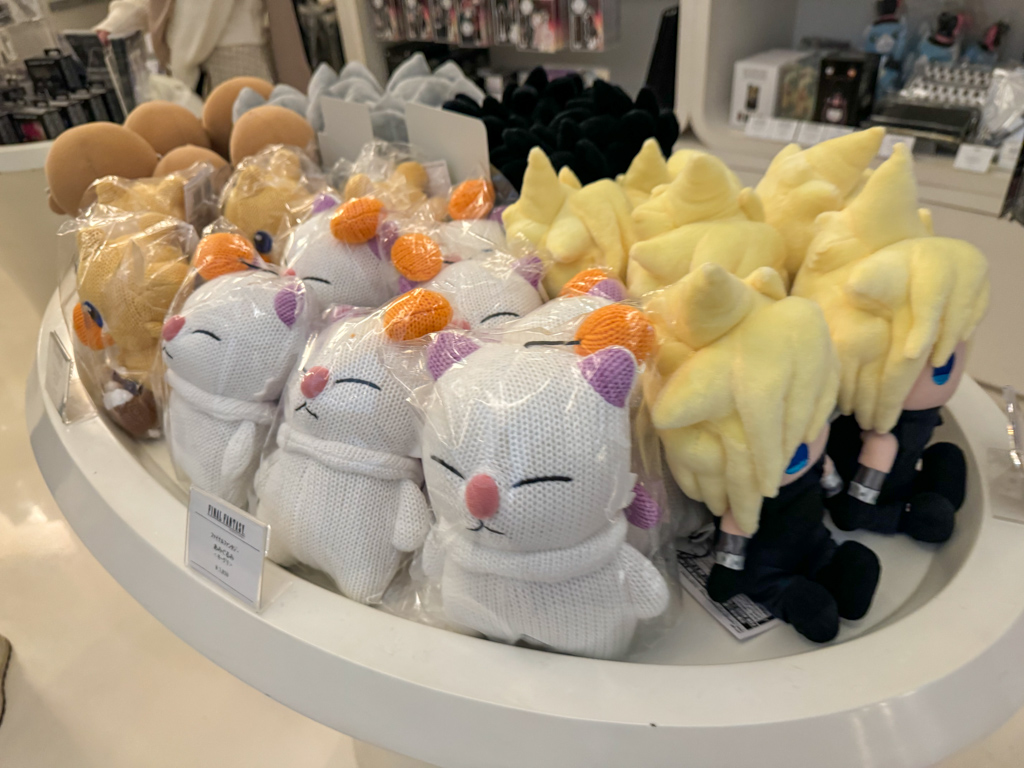Final Fantasy ARTNIA souvenir shop featuring cloud and moogle stuffed toys