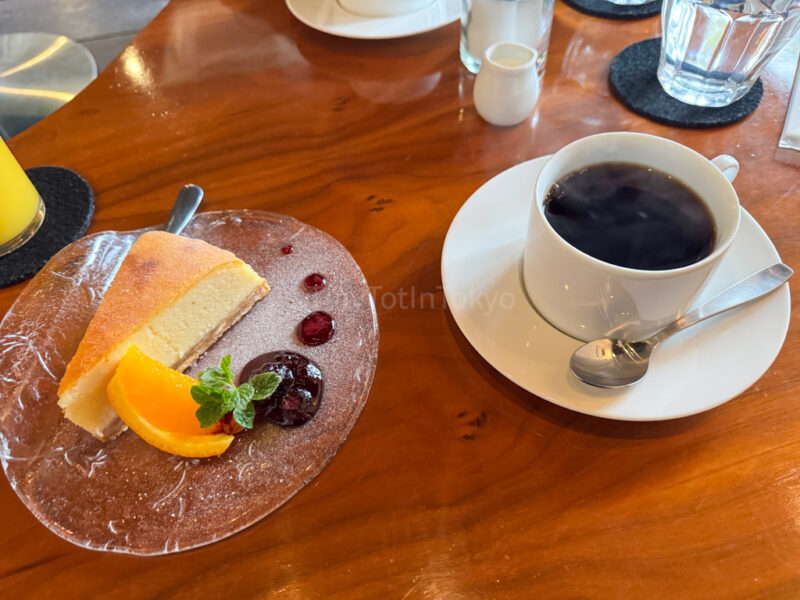 a plate of cheesecake with coffee at Cafe Lente in Hiroshima