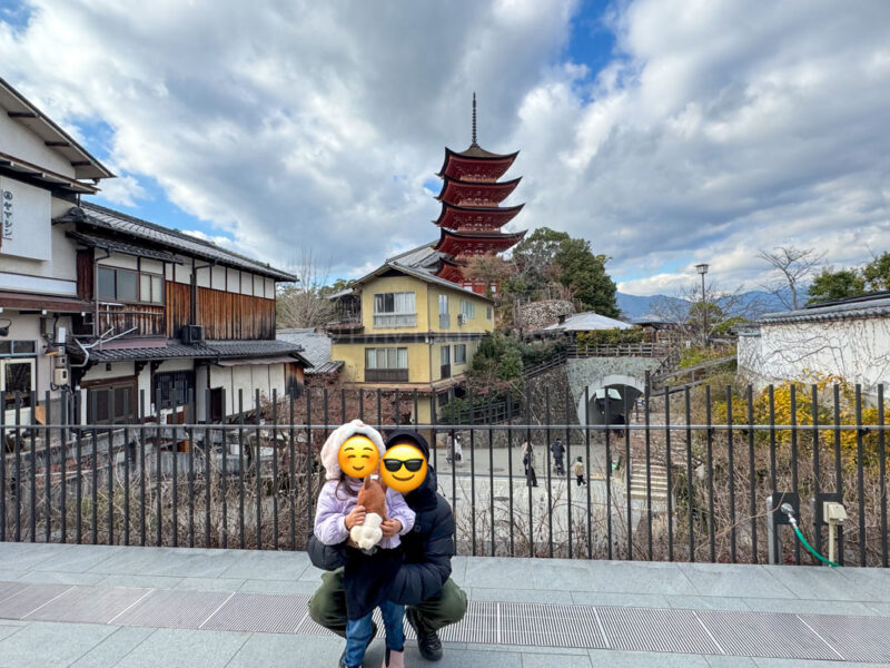 A child and their parent on the observation deck in Miyajima