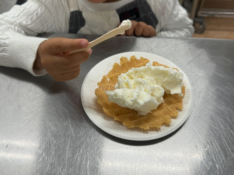 A child eating ice cream they made at Furano Cheese Factory