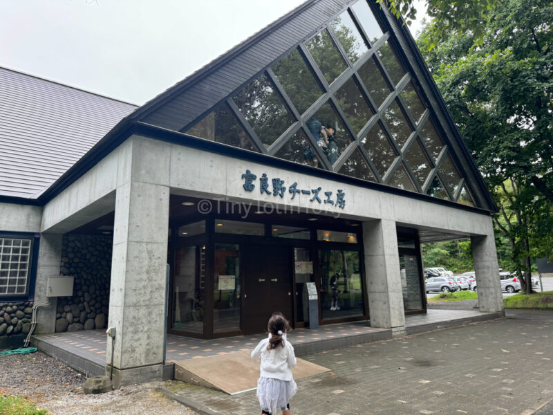 A child running into Furano Cheese Factory