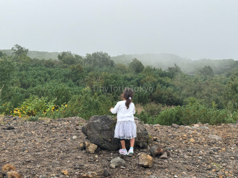 Child walking up Tokachidake Observatory in Biei Hokkaido