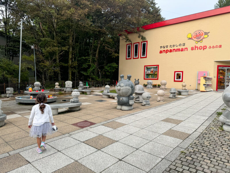 A child walking outside the Anpanman shop in Furano