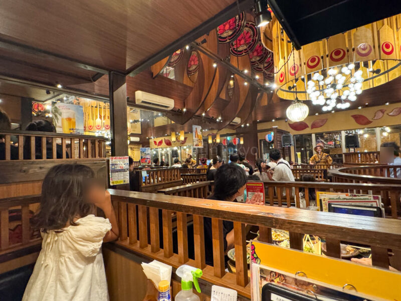 a child listening to live Okinawa music at Paikaji restaurant