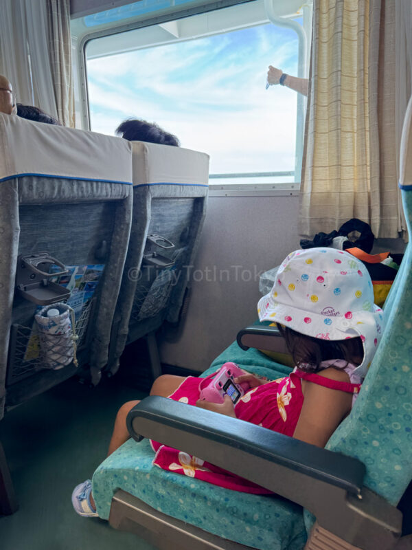 a child inside the ferry to Tokashiki Island