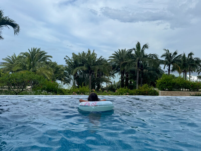 a child swimming at Kafuu Resort Fuchaku Condo in Okinawa