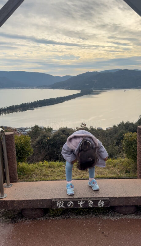 a child looking at the view at Amanohashidate