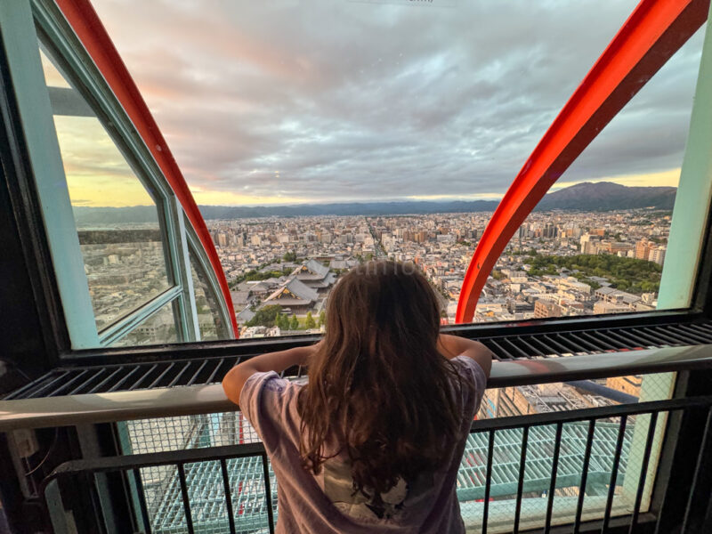 a child looking out from Kyoto Tower