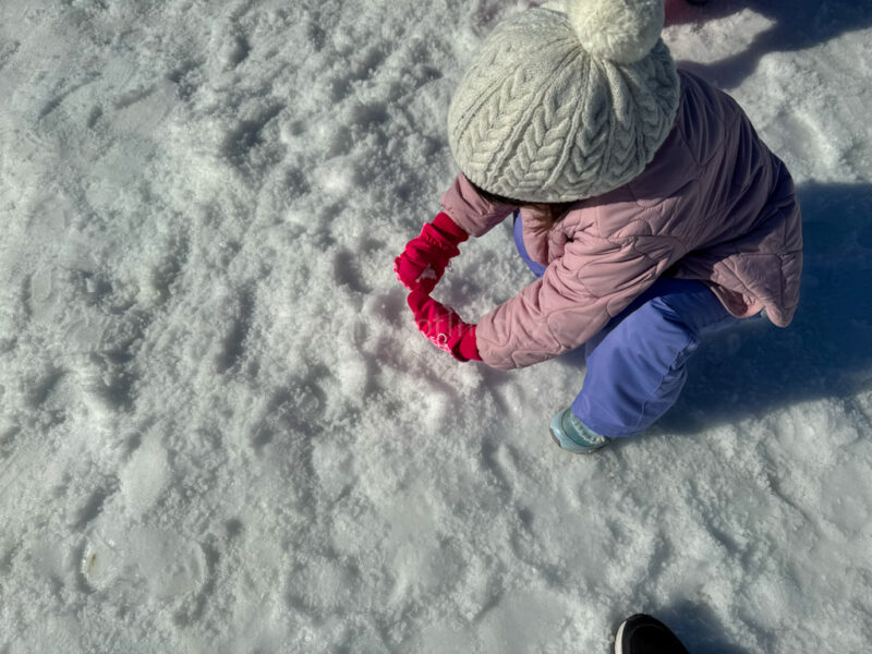 A child playing with snow at Hirakata Park 