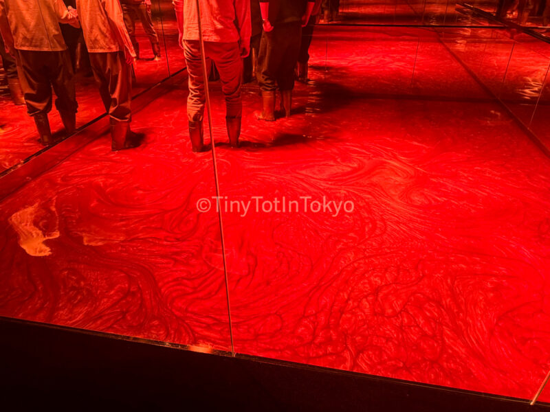 people walking through Transient Abstract Life and Return at teamLab Kyoto in boots