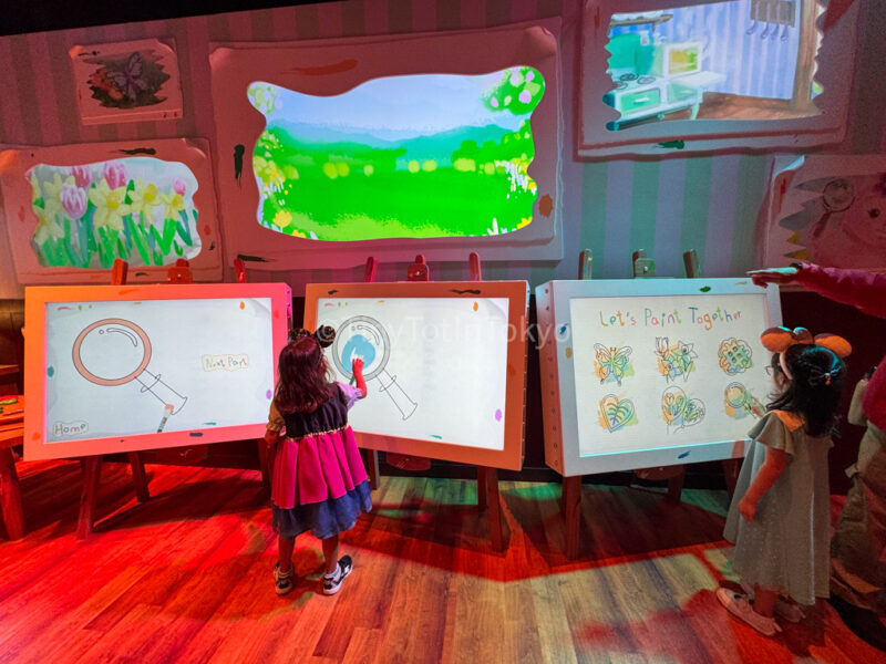 A child playing inside Duffy and Friends Playhouse at Hong Kong Disneyland
