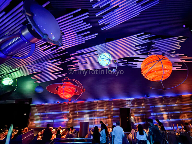 People waiting inside hyperspace mountain at Hong Kong Disneyland