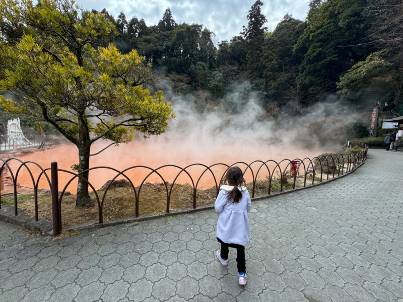 a child at Chinoike Jigoku onsen in Beppu