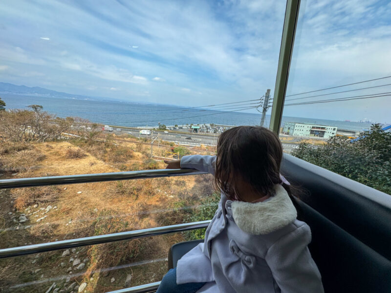 a child taking the monorail to Takasakiyama Natural Zoological Garden