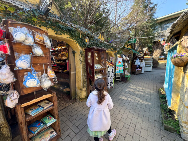 a child walking through yufuin floral village