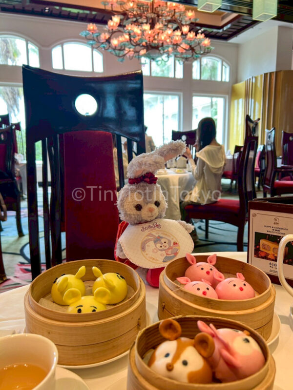 StellaLou with a bib at dim dum hong kong disneyland