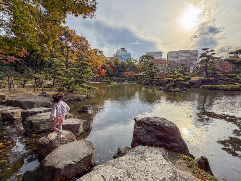 a child at Keitakuen Garden in tennoji