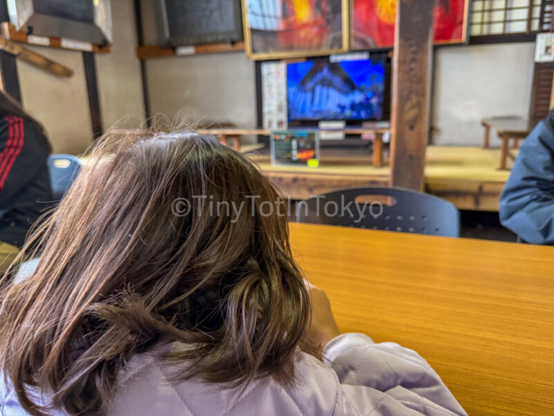 a child in the rest area at Todai-ji Nigatsu-do (February Hall) in Nara