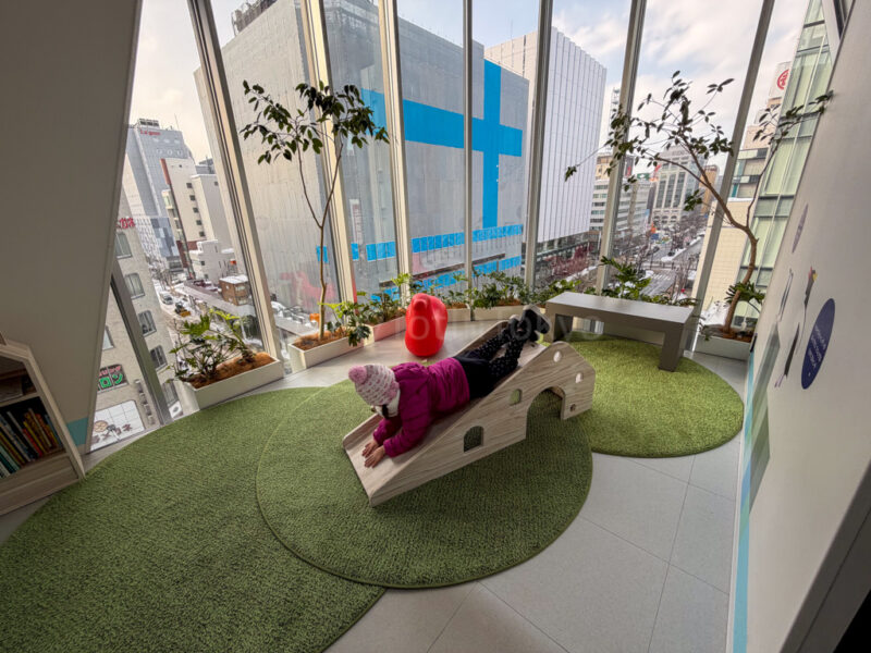 a child playing at aoao aquarium in sapporo